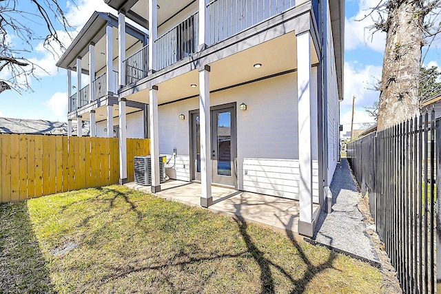 6716 Ave R, Houston, TX 77011 - rear view of property featuring a balcony, a fenced backyard, and cooling unit