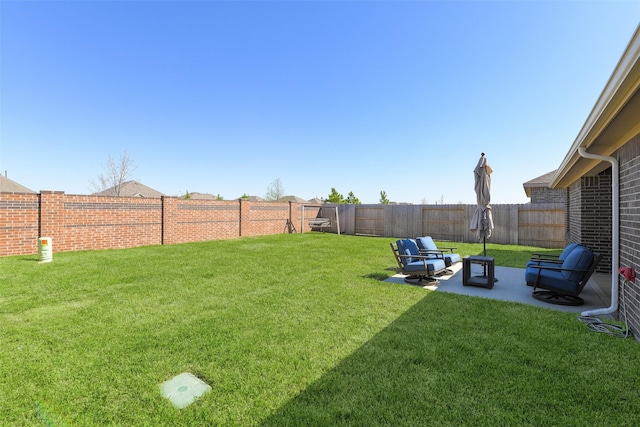 view of yard featuring a patio and a fenced backyard