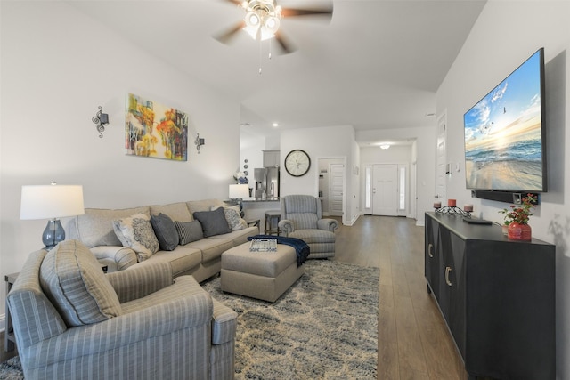 living room featuring wood-type flooring and ceiling fan