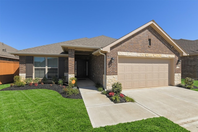 view of front of house with roof with shingles, an attached garage, a front lawn, concrete driveway, and brick siding