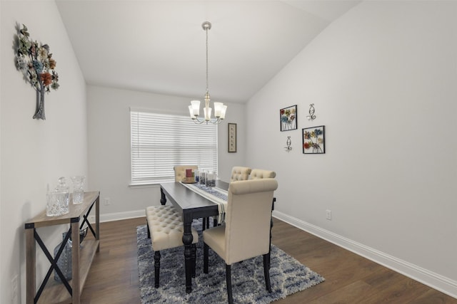 dining area featuring a chandelier, baseboards, dark wood finished floors, and vaulted ceiling