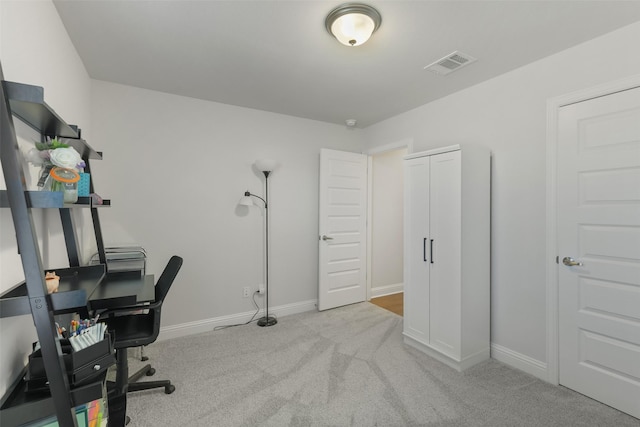 office space with visible vents, carpet flooring, and baseboards