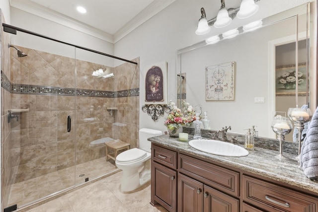 bathroom featuring toilet, ornamental molding, a shower stall, tile patterned flooring, and vanity