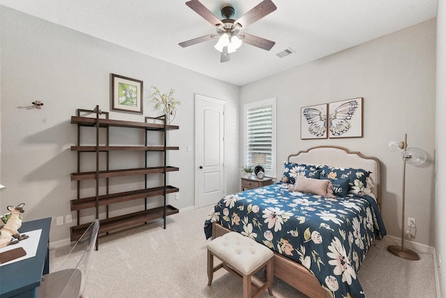 bedroom featuring visible vents, baseboards, carpet, and a ceiling fan