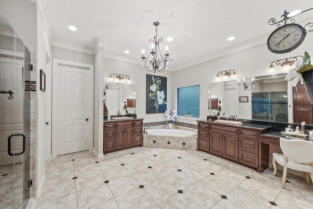 bathroom with a sink, a garden tub, a stall shower, and ornamental molding