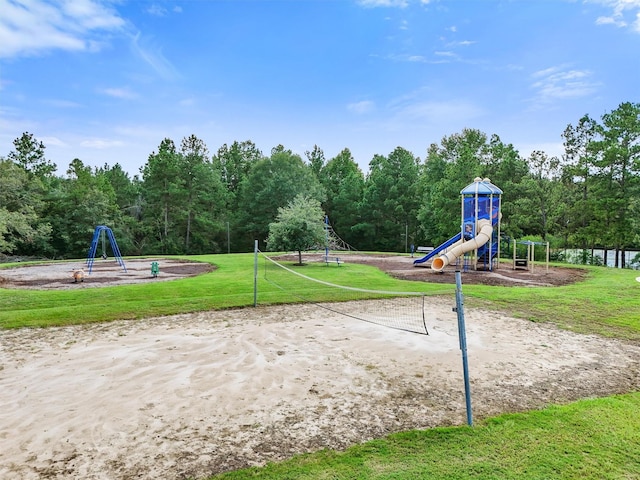 view of community with a lawn, playground community, and volleyball court