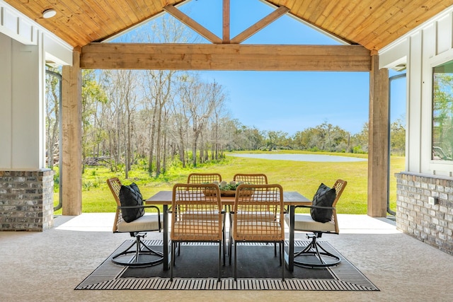 view of patio / terrace featuring outdoor dining area and a water view