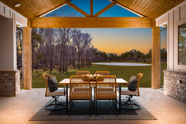 view of patio featuring outdoor dining area and a water view