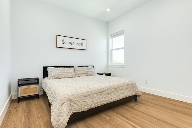 bedroom featuring recessed lighting, baseboards, and wood finished floors