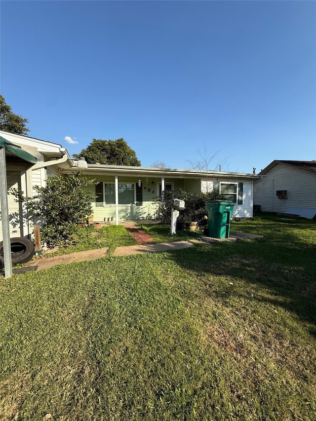 rear view of house with a lawn