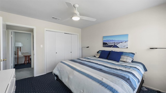 bedroom with a closet, visible vents, ceiling fan, and dark colored carpet