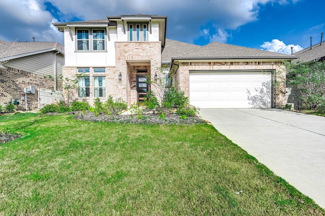 view of front of home with roof with shingles, concrete driveway, a front yard, an attached garage, and brick siding