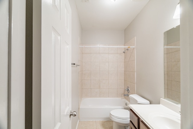 bathroom featuring tile patterned floors, toilet, vanity, and shower / bathing tub combination