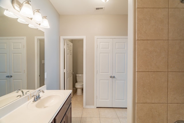 full bath featuring tile patterned floors, visible vents, toilet, a closet, and vanity