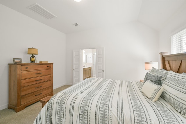 bedroom featuring vaulted ceiling, baseboards, visible vents, and light carpet