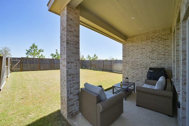 view of patio with an outdoor living space and a fenced backyard