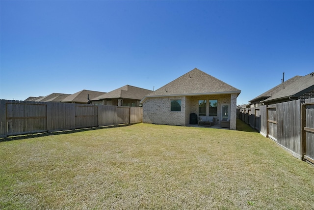 view of yard with a fenced backyard