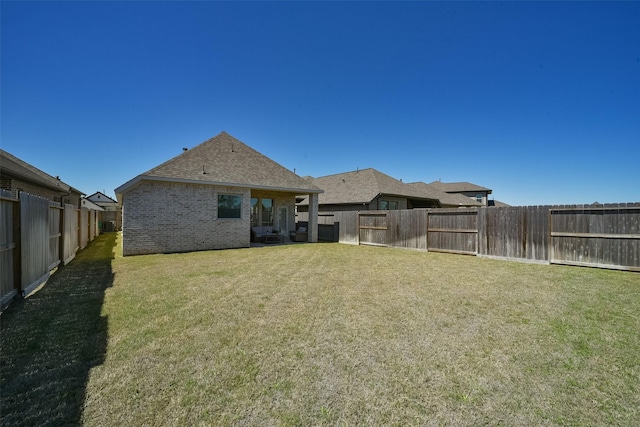 view of yard featuring a fenced backyard