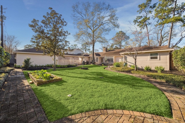 view of yard featuring a garden