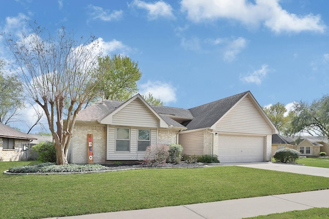 view of front facade featuring a garage, driveway, brick siding, and a front lawn