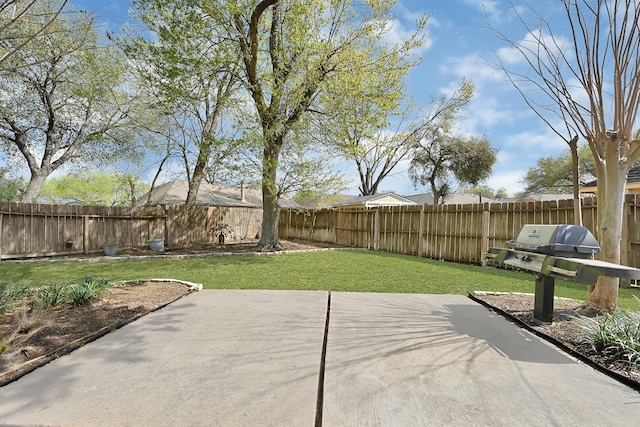 view of patio featuring area for grilling and a fenced backyard