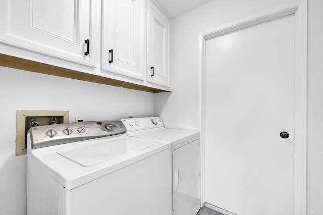 laundry room with washer and dryer and cabinet space