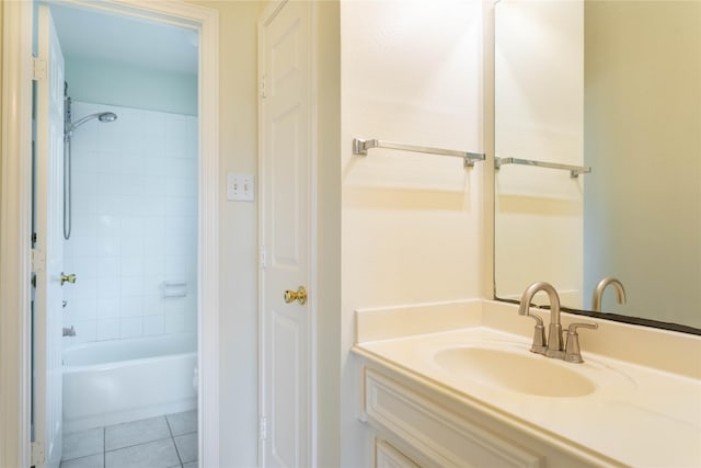 full bath featuring vanity, washtub / shower combination, and tile patterned flooring