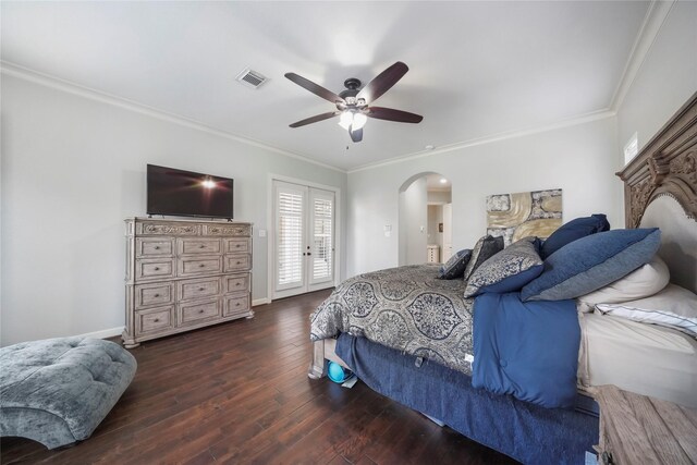 bedroom with visible vents, crown molding, baseboards, hardwood / wood-style floors, and arched walkways