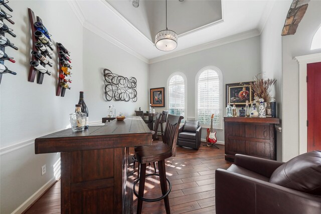 office area featuring baseboards, dark wood-style flooring, and crown molding