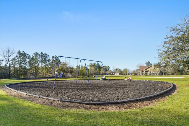 communal playground with a lawn