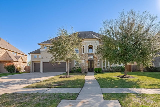 10018 Durango Path Ln, Cypress, TX 77433 - view of front of home with a front yard, fence, driveway, stucco siding, and a garage