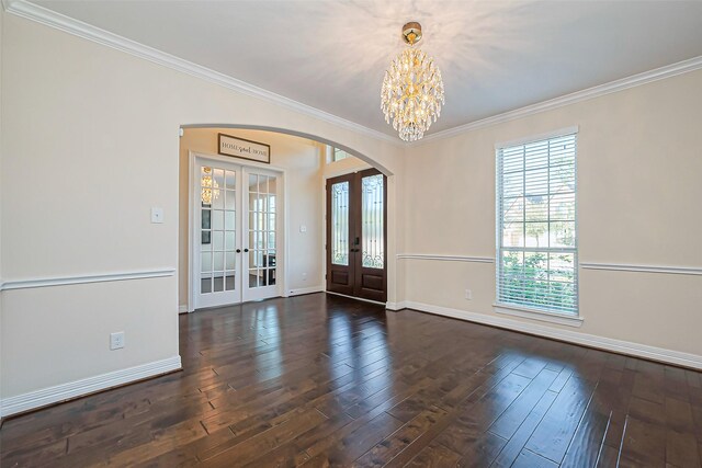 10018 Durango Path Ln, Cypress, TX 77433 - entrance foyer with arched walkways, a notable chandelier, french doors, and hardwood / wood-style floors