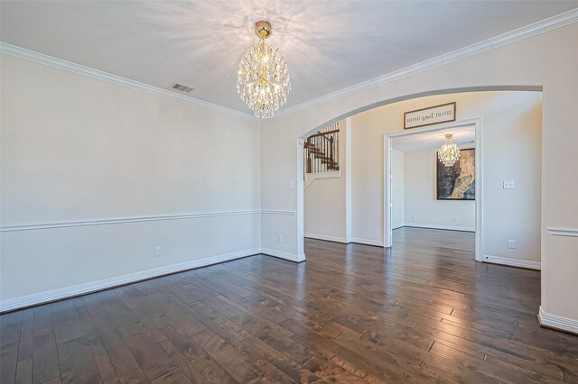 10018 Durango Path Ln, Cypress, TX 77433 - empty room with arched walkways, ornamental molding, an inviting chandelier, and hardwood / wood-style flooring