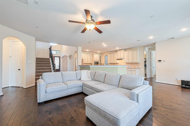 10018 Durango Path Ln, Cypress, TX 77433 - living room featuring stairs, visible vents, ceiling fan, and dark wood finished floors