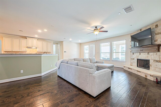 10018 Durango Path Ln, Cypress, TX 77433 - living room with visible vents, baseboards, a ceiling fan, and dark wood-style flooring