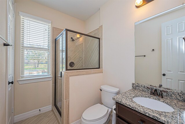 10018 Durango Path Ln, Cypress, TX 77433 - full bathroom featuring vanity, a shower stall, and toilet