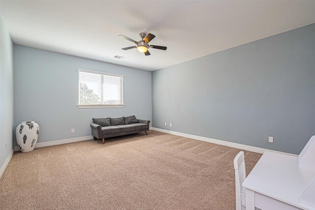 10018 Durango Path Ln, Cypress, TX 77433 - living area featuring visible vents, light carpet, baseboards, and a ceiling fan
