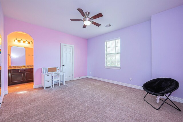 10018 Durango Path Ln, Cypress, TX 77433 - bedroom featuring visible vents, connected bathroom, baseboards, ceiling fan, and light carpet