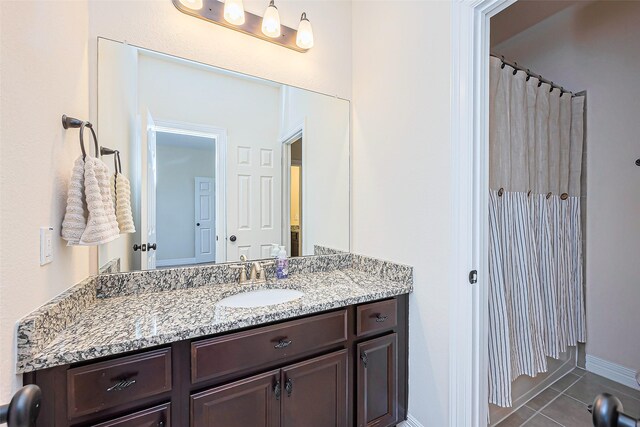 10018 Durango Path Ln, Cypress, TX 77433 - full bath with vanity, tile patterned floors, and baseboards