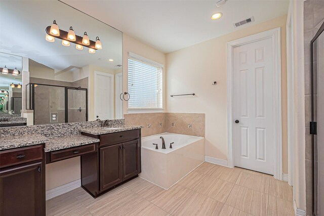 10018 Durango Path Ln, Cypress, TX 77433 - full bath featuring a bath, visible vents, a shower stall, and vanity