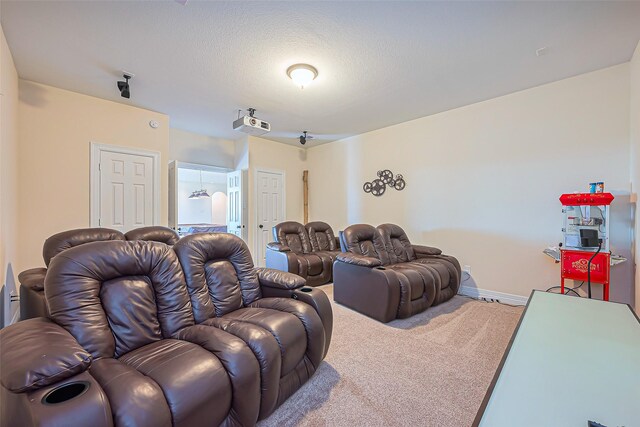 10018 Durango Path Ln, Cypress, TX 77433 - cinema room with baseboards, a textured ceiling, and carpet