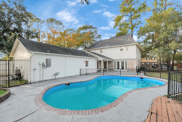 view of pool featuring a patio area, fence, a fenced in pool, and french doors