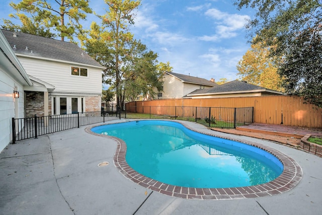 view of pool featuring a patio area, a fenced in pool, and a fenced backyard