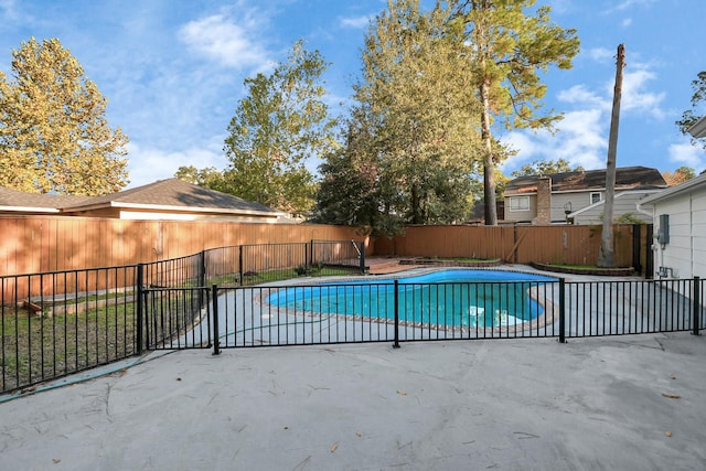 view of pool with a fenced in pool, fence private yard, and a patio