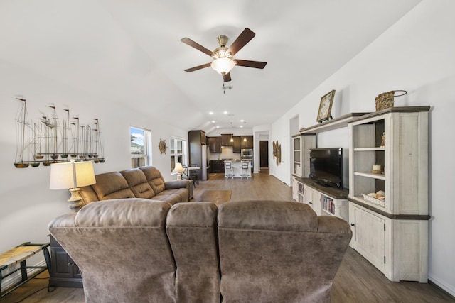 living area featuring lofted ceiling, recessed lighting, dark wood-style floors, and ceiling fan