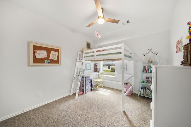 carpeted bedroom with visible vents, a ceiling fan, and baseboards