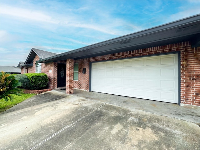 ranch-style home featuring a garage, brick siding, and driveway