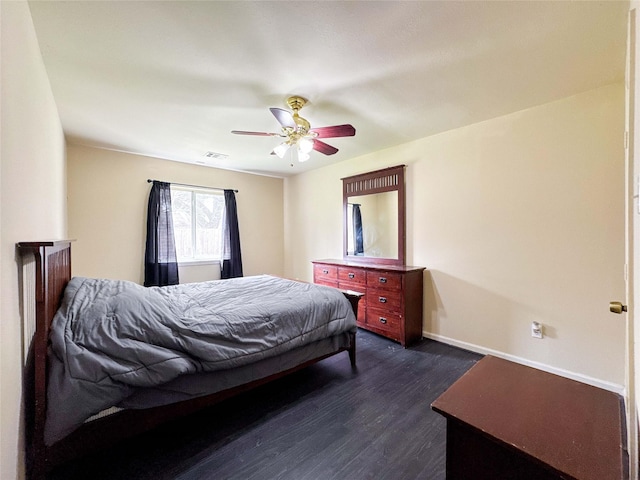 bedroom featuring dark wood-type flooring, baseboards, visible vents, and ceiling fan