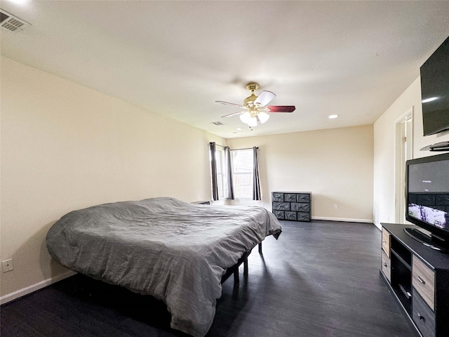 bedroom featuring visible vents, ceiling fan, baseboards, and dark wood-style flooring