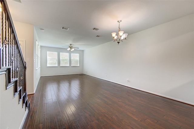 interior space with visible vents, dark wood finished floors, stairs, and ceiling fan with notable chandelier